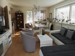 a living room with a couch and a table at Ubytovanie v súkromí na Liptove in Liptovský Ján