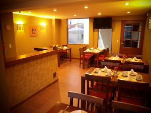 a dining room with tables and chairs in a restaurant at Hotel Los Tambos Boutique in Arequipa