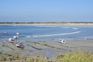 a group of boats sitting in the water at les volets bleus in Saint-Guénolé