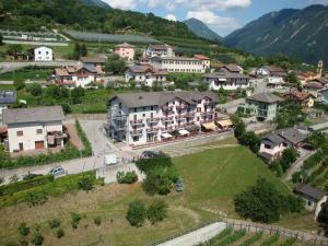 an aerial view of a village with houses and a road at Hotel Spera in Strigno
