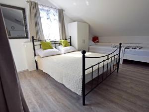 Giường trong phòng chung tại Apartman Branka