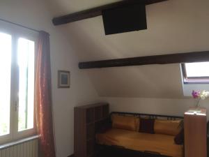 a bedroom with a bed and a window at Villa Puccini Bed & Breakfast in Lecco