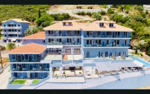 an aerial view of a large blue building at Ponti Beach Hotel in Vasiliki