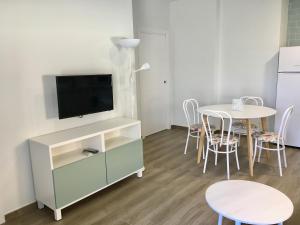 A television and/or entertainment centre at AT SAN MIGUEL o