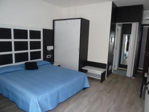 Postel nebo postele na pokoji v ubytování Albergo Casa Este