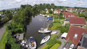 an aerial view of boats docked in a river at Villa Envie in Terherne