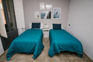 Postel nebo postele na pokoji v ubytování Infinium Zamora Suites