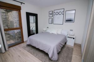 Postel nebo postele na pokoji v ubytování Infinium Zamora Suites