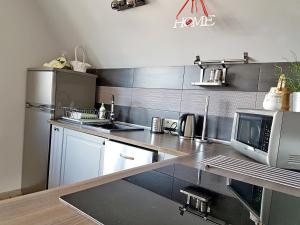 Kuchyňa alebo kuchynka v ubytovaní Apartament Podkowa z widokiem na Giewont