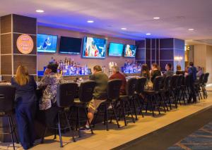 a group of people sitting at a bar at Plaza Hotel & Casino in Las Vegas