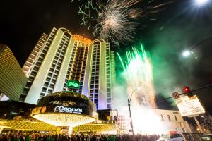 a firework display in front of a building with fireworks at Plaza Hotel & Casino in Las Vegas