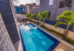 an overhead view of a swimming pool in a building at IMPERIAL TAMBAU Flat by PenareiaTurBr in João Pessoa