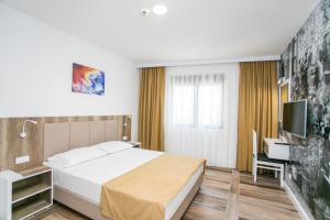 Postel nebo postele na pokoji v ubytování Villa Delux