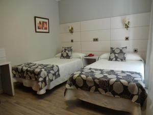 Llit o llits en una habitació de Hotel Los Naranjos