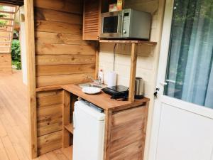 a kitchen with a sink and a microwave at Эко отель Прованс Одесса in Odesa