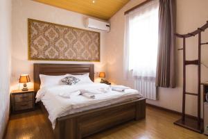 Postel nebo postele na pokoji v ubytování Hotel Garden House