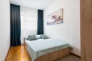 Postel nebo postele na pokoji v ubytování Apartman Edi