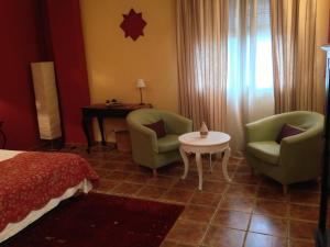 A bed or beds in a room at Hotel Sierra Quilama