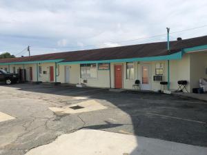 an empty parking lot in front of a building at Budget Inn in Donalsonville