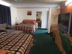 Postel nebo postele na pokoji v ubytování Townhouse Motel