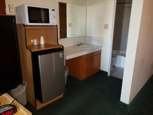 Kuchyň nebo kuchyňský kout v ubytování Townhouse Motel