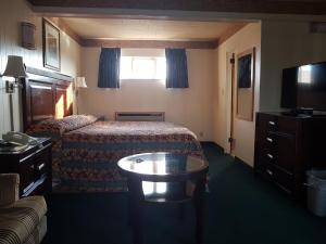 Postel nebo postele na pokoji v ubytování Townhouse Motel
