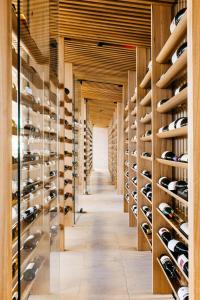 a corridor of a wine cellar with wooden racks at Royal Mail Hotel in Dunkeld