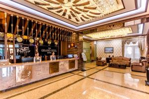 a lobby with a bar in a hotel at Grand Hill Hotel Ulaanbaatar in Ulaanbaatar