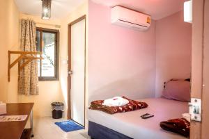 Postel nebo postele na pokoji v ubytování Tuk Tuk Guesthouse