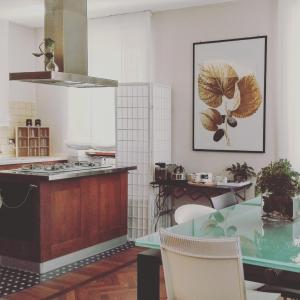 a kitchen with a counter and a table in it at Largo Fileni 7 in San Benedetto del Tronto