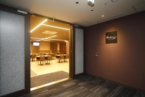 a conference room with a table in the background at Dormy Inn Korakuen in Tokyo