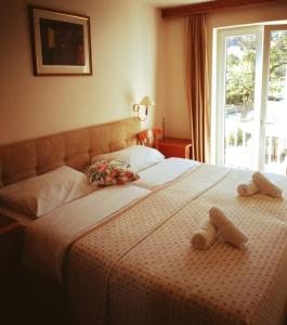 Postel nebo postele na pokoji v ubytování Hotel Dubrovnik