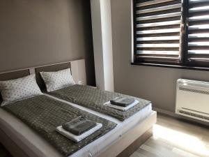 Кровать или кровати в номере Apartment Trimontium 2