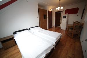 Postel nebo postele na pokoji v ubytování Eged Vendégház