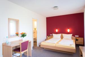 Säng eller sängar i ett rum på Gästehaus Höferlin