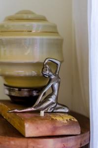 a bronze statue of a person standing on a table at Luxury City One-bedroom Apartment in Heraklio