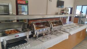 a kitchen with a counter with food on it at Hamsikoy Hotel in Hamsikoy