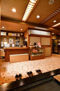 a room with shoes on the floor in a store at Ryokan Tamura in Kusatsu