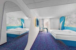 Postel nebo postele na pokoji v ubytování Prize by Radisson, Hamburg St Pauli + 37 fotografií