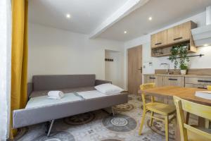 a small room with a bed and a table at Valbonne Flat in Valbonne +47 photos