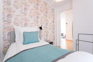 Łóżko lub łóżka w pokoju w obiekcie Mar Suite Apartments - Center