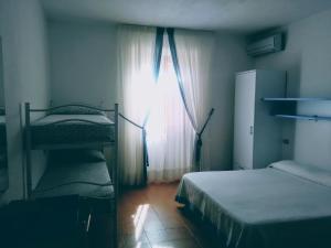 Postel nebo postele na pokoji v ubytování B&B da AnnaMaria + 19 fotografií