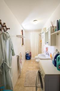 a bathroom with two toilets and a sink at Magnolia B&B in Silvi Marina