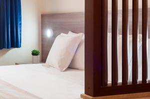Una cama o camas en una habitación de Blubay Suites by ST Hotels