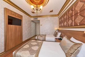 Postel nebo postele na pokoji v ubytování VERSİON HOTEL
