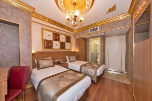Postel nebo postele na pokoji v ubytování VERSİON HOTEL