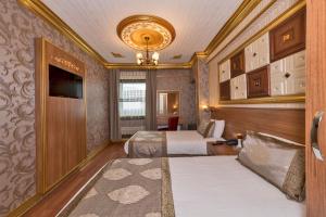 Postel nebo postele na pokoji v ubytování VERSİON HOTEL