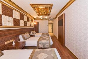 Postel nebo postele na pokoji v ubytování VERSİON HOTEL