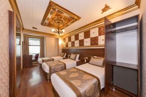 Postel nebo postele na pokoji v ubytování VERSİON HOTEL