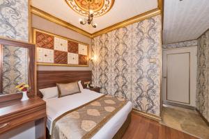 Postel nebo postele na pokoji v ubytování VERSİON HOTEL